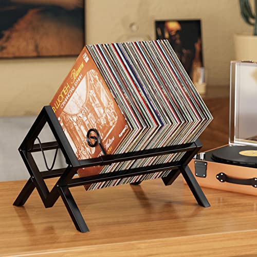 Eknitey black metal vinyl record stand holding around 100 upright LPs on the floor